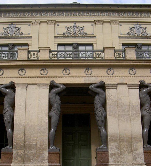 Giant caryatids holding up a building in Moscow